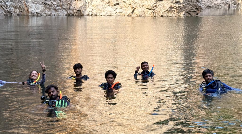 PADI certified scuba diving instructor guiding a beginner at Bond Safari Kovalam
